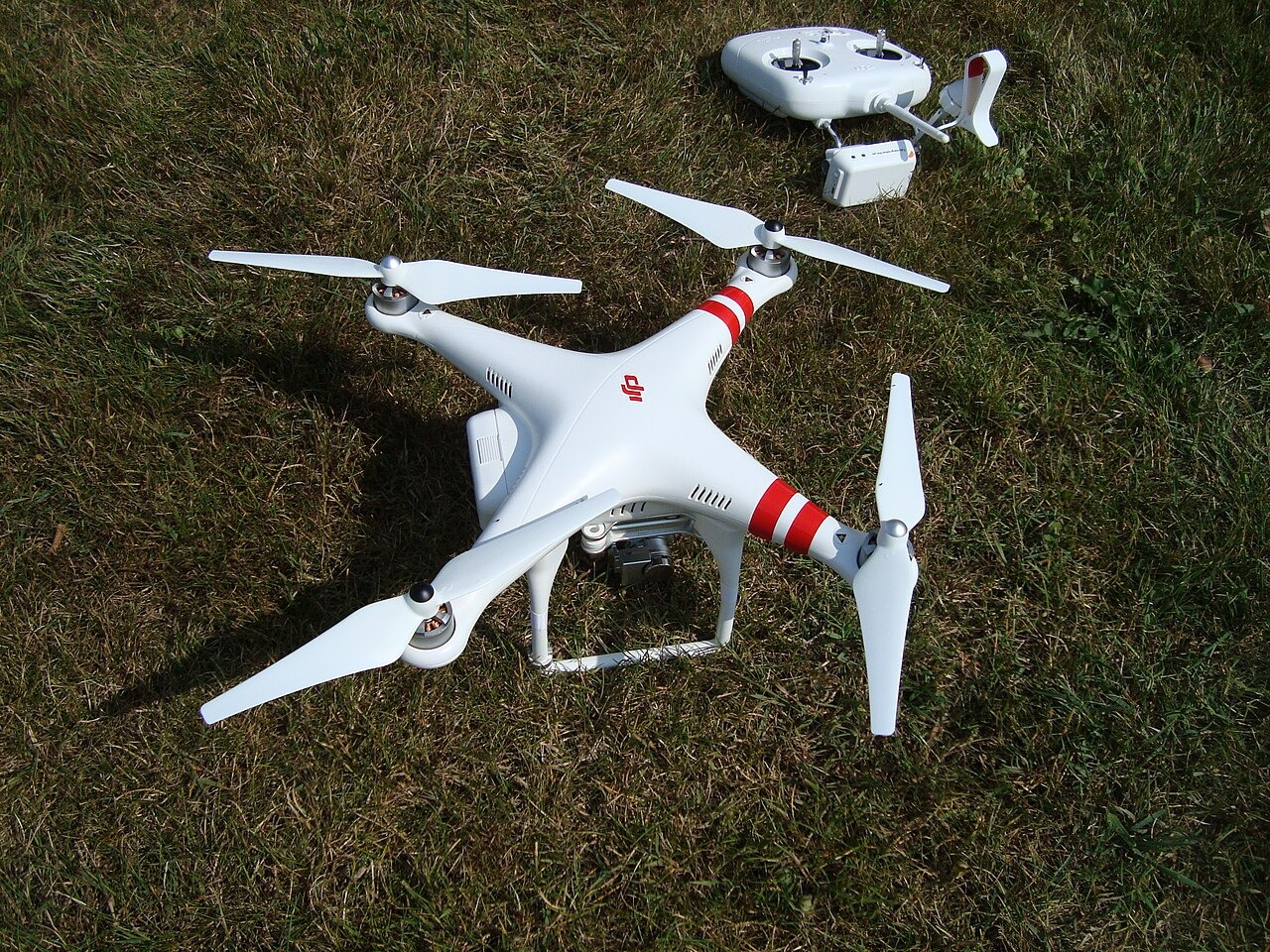 File photo: File photograph of a DJI Phantom 2 Vision+ quadcopter and its controller on grass. Illustrative context; not a photograph of the reported event.
